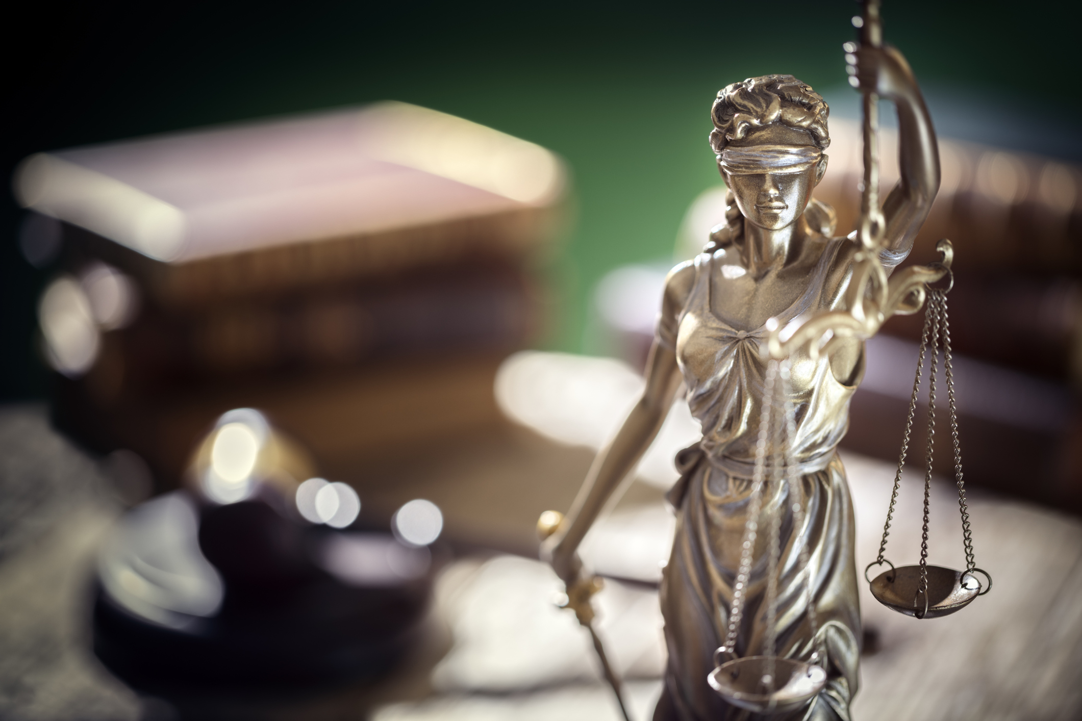 Legal and law concept statue of Lady Justice with scales of justice and judge gavel
