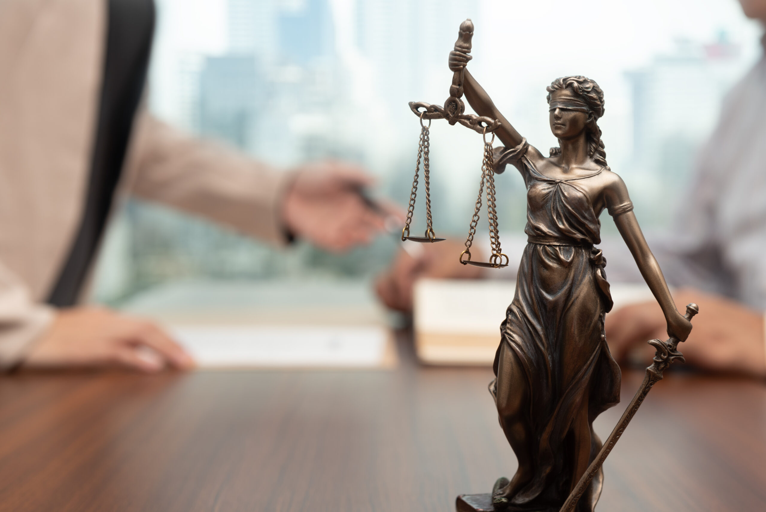 law and legal services concept. judge consult and women lawyer or attorney having team meeting with client at legal firm.